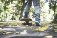 Boy with skateboard in park i...