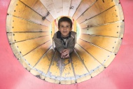 Boy in a tunnel at playground