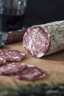 Sliced salami on cutting board
