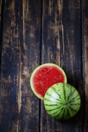 Sliced mini watermelon on dar...