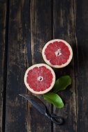 Sliced red grapefruit, leaves...