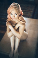 Sexy blond woman sitting nake...