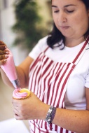 Confectioner making cup cake