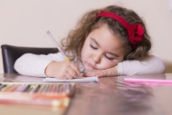 Portrait of drawing little girl