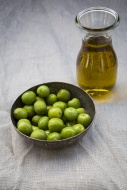 Bowl of green olives and cara...