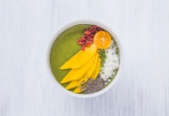 Bowl of green smoothie with t...