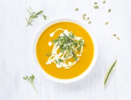 Bowl of carrot pumpkin soup w...