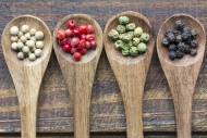 Row of four wooden spoons of ...