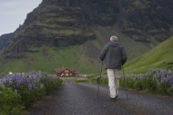 Iceland, Man walking on count...