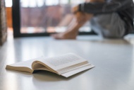 Opened book lying on floor