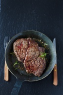 Rib eye steak with rosmary in...