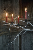 Four lighted Advent candles o...