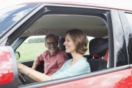 Happy mature couple in car