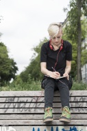 Young woman drawing on park b...