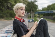 Young woman with headphones d...