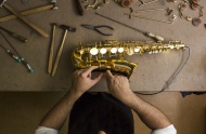 Instrument maker repairing a ...