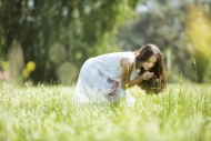 Woman standing on a meadow sm...