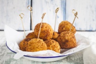 Arancini with skewers on a plate