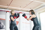 Two fit senior women boxing i...