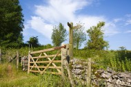 A gate and footpath signpost ...