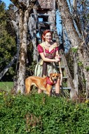 Woman in dirndl, with dog in ...