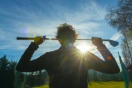 Golfer Leaning Her Golf Club ...