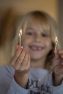 Girl (7) plays with matches.,...