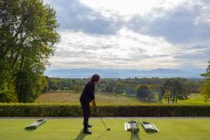 Woman on Driving Range with P...