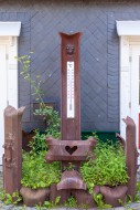 Large iron thermometer.