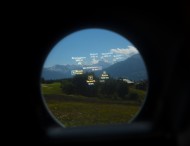Looking through a telescope w...