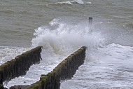 Wave crashing into wooden gro...