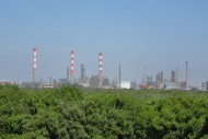 Oil refinery with chimneys an...
