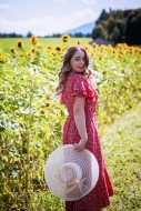 Young woman with hat in hand,...