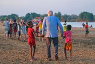 Malagasy children helping eld...