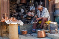 Moroccan coppersmith working ...