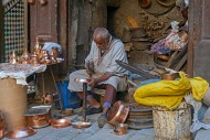 Moroccan coppersmith working ...
