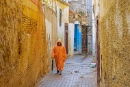Muslim man wearing orange dje...