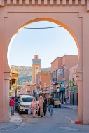 Minaret and Moroccans walking...