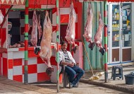 Moroccan butcher posing with ...
