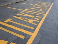 yellow taxi road marking sign