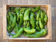 green peppers in crate