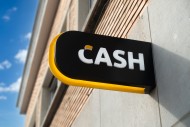 Sign showing logo of ATM cash...