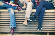 Legs of students sitting on a...