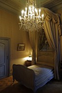 Chandelier and canopy bed in ...