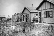Residents in front of wooden ...