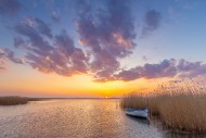 Rowing boat / rowboat along r...