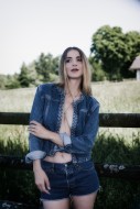 Young blonde woman with denim...