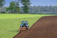 Tractor with plough, agricult...