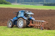 Tractor with plough, agricult...