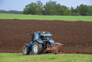 Tractor with plough, agricult...